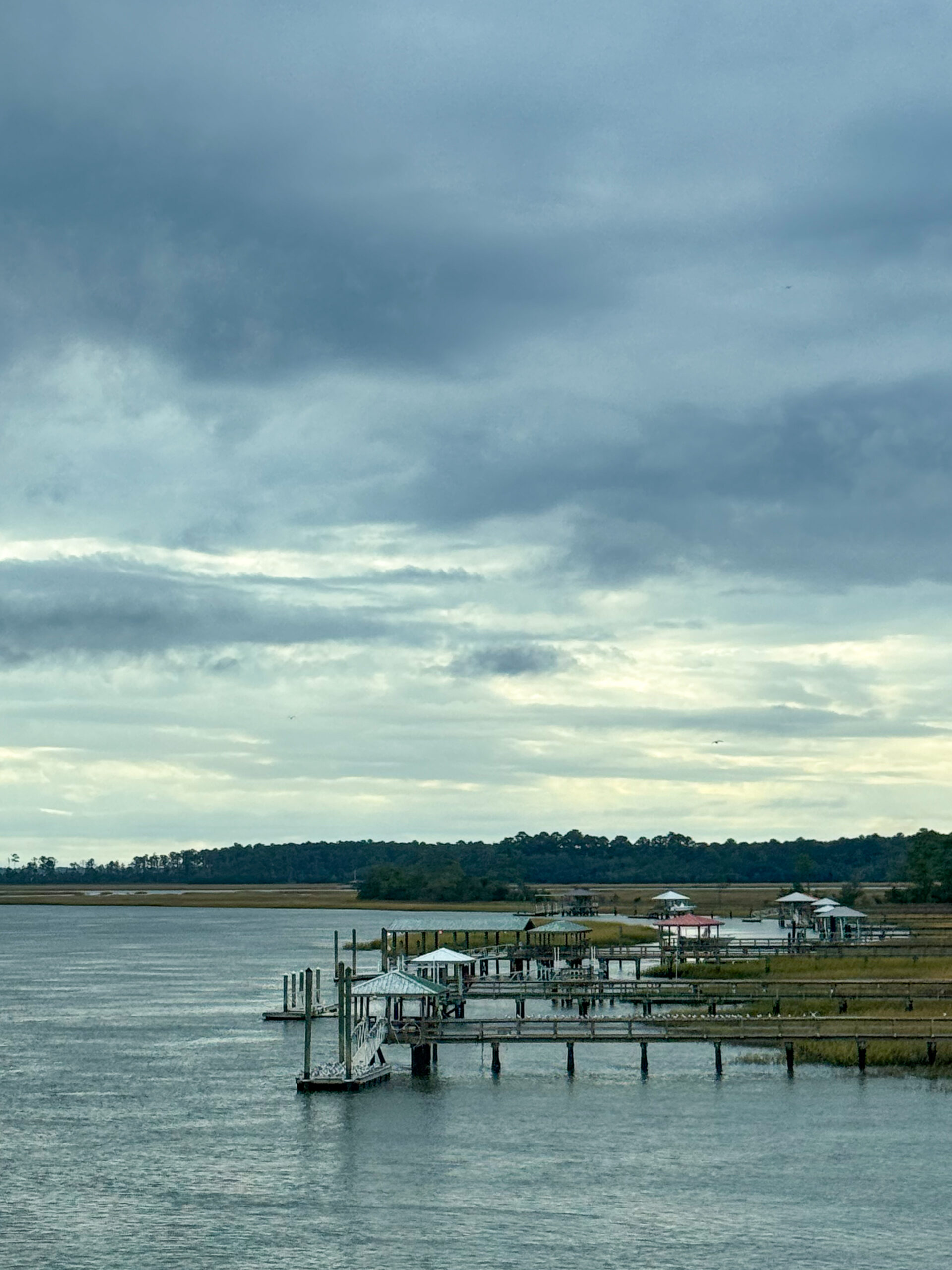 series-of-waterfront-docks-on-tidal-river-under-moody-sky-artist-reference-photo