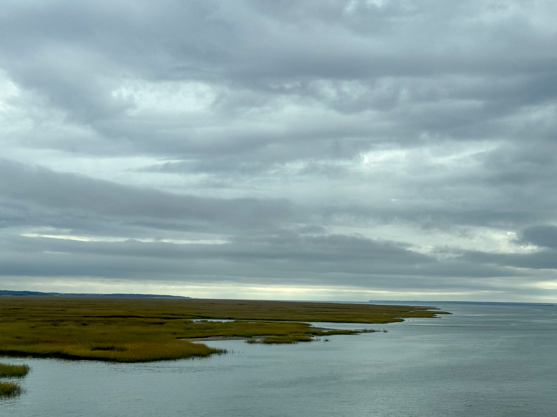 winding-marsh-inlet-meeting-ocean-under-stormy-cloudscape-artist-reference-photo