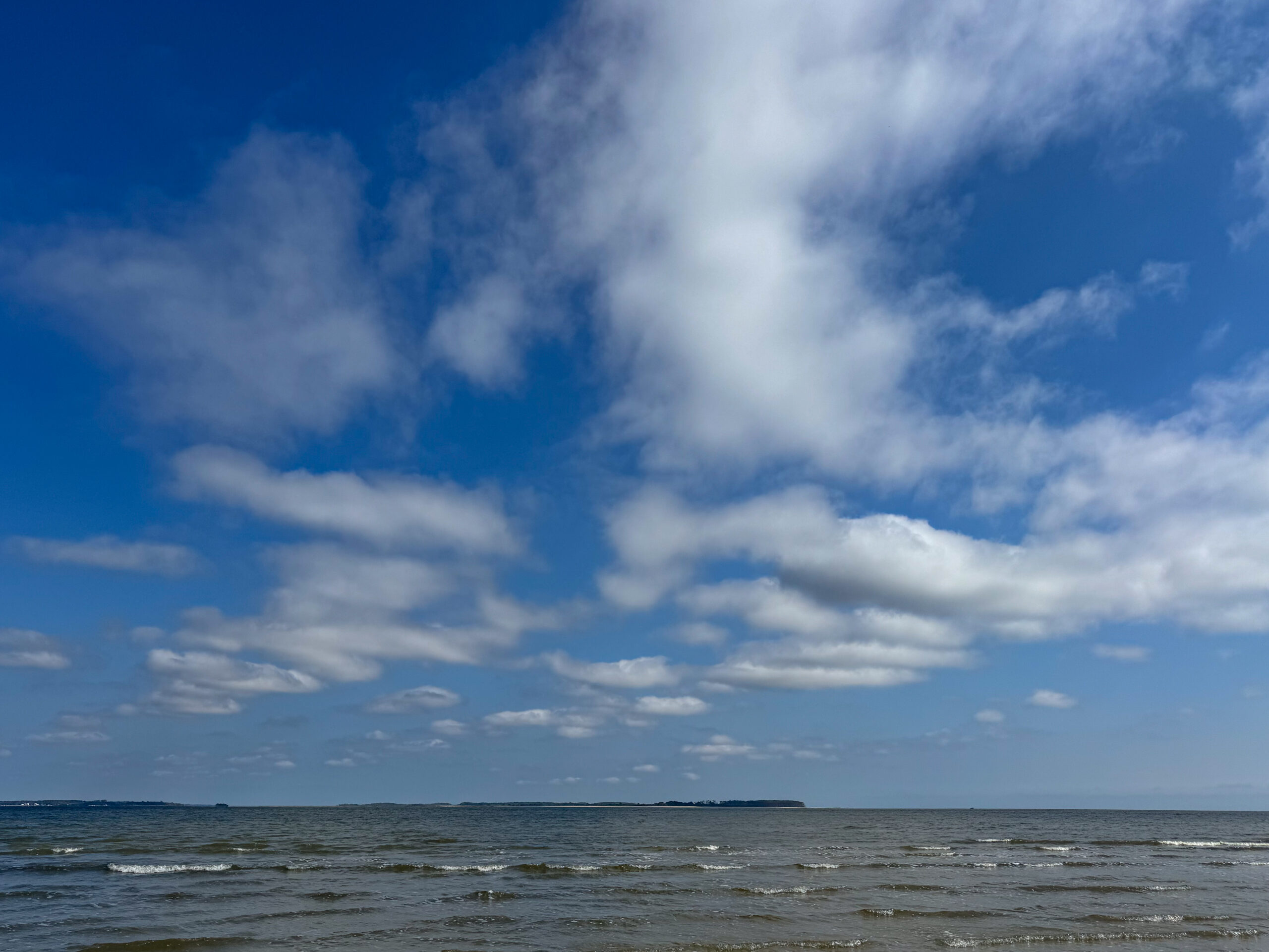 ocean horizon with rippling waves and scattered clouds artist reference photo