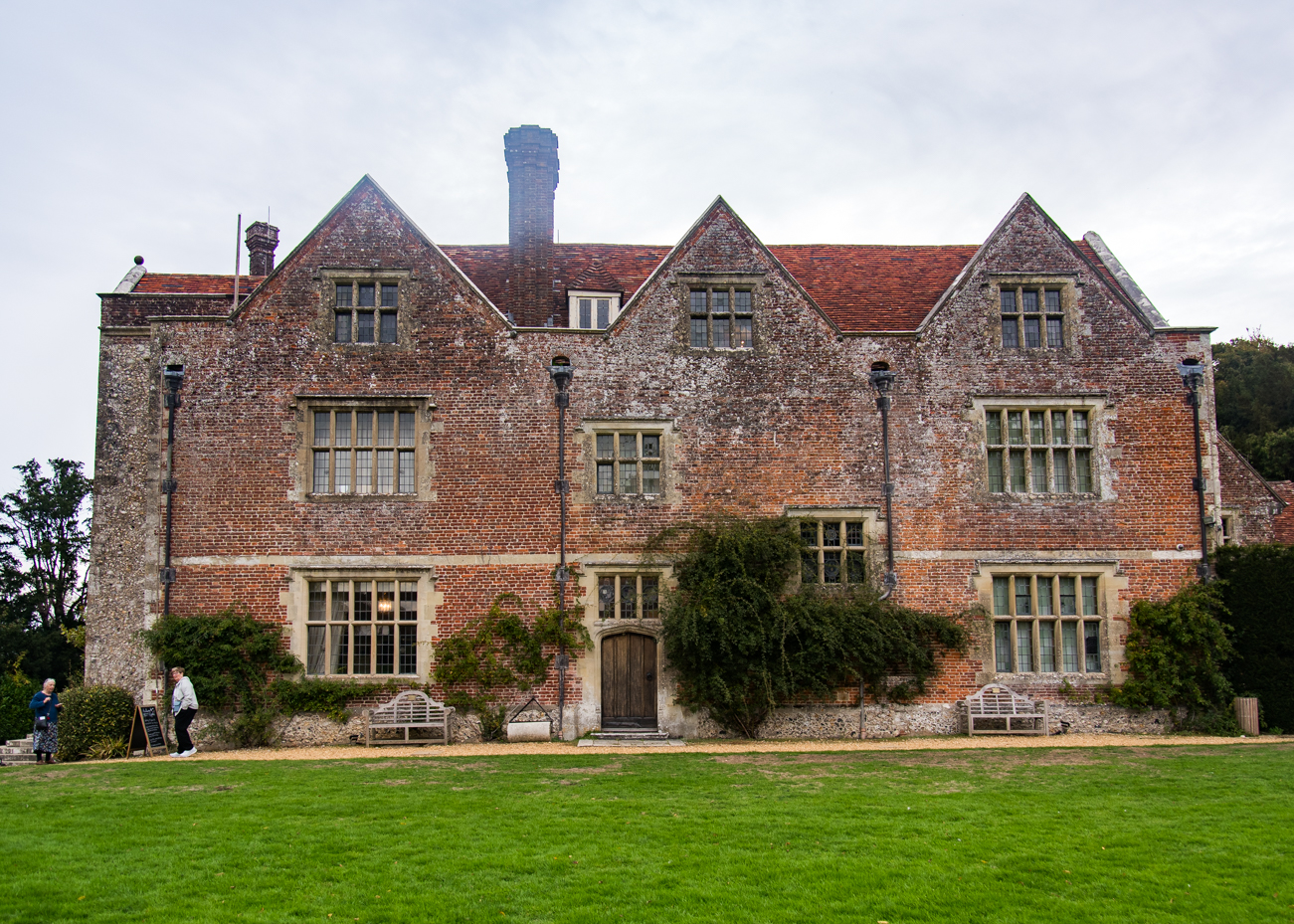 Tudor style brick estate building with ivy artist reference photo